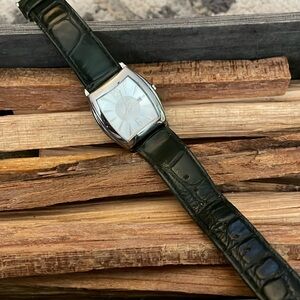 Furla wristwatch with crystals on edge and dark green croco band, date display